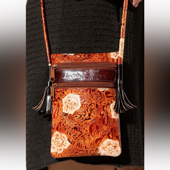 ruggine Handbags - NWT! Hand-painted genuine leather bag with embossed floral pattern tassel